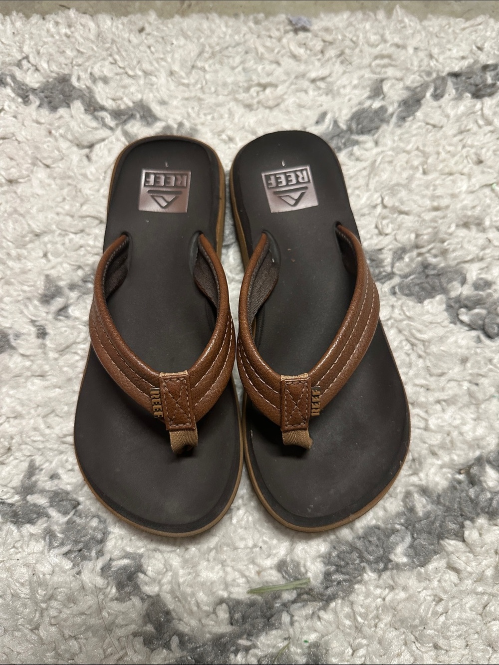 Reef girl’s 's Brown and Black Leather Flip Flops